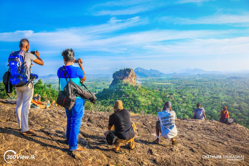 photographers taking pictures of Sigiriya at Pidurangala